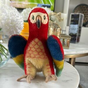 Steiff Mohair 60’s Parrot. 9-10” tall. Tail is down. Brand button on wing.
